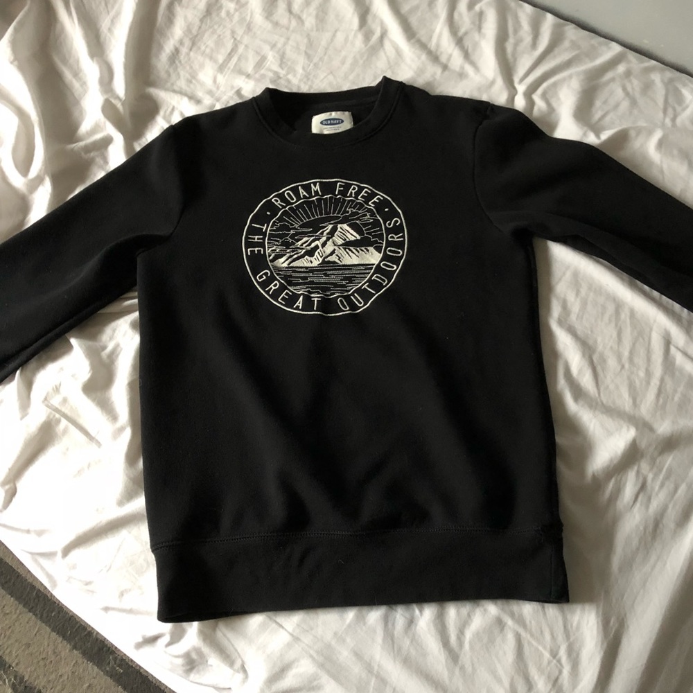 Black sweater with design on front